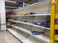Empty shelves in a Tesco supermarket in east London after shoppers panic buy essential items as they prepare for a potential UK lockdown for an oncoming coronavirus outbreak and self isolation.
