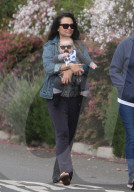 Italia Ricci and her baby boy Robert Amell V wear matching sunglasses as they take a stroll around the neighborhood