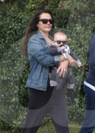Italia Ricci and her baby boy Robert Amell V wear matching sunglasses as they take a stroll around the neighborhood