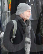 Iron Maiden lead singer Bruce Dickinson, 61, wraps up in a hat and scarf as he arrives in Moscow for an undisclosed visit.