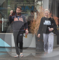 LA Rain ain t going to stop Jason Priestley and his Wife/Trainer Naomi Lowde-Priestley from hitting the gym for an early morning workout in Los Angeles
