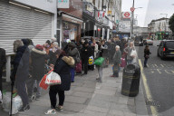 Queues outside a Saver Centre in Willesden