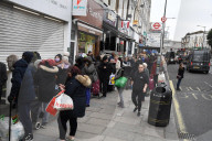 Queues outside a Saver Centre in Willesden