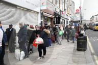 Queues outside a Saver Centre in Willesden