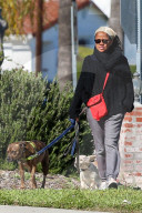 Meghan MarkleÍs mother Doria Ragland takes her dogs for a walk, hours after news broke that her daughter and Prince Harry have moved to Los Angeles. 