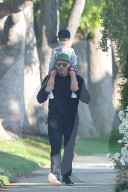 Hollywood tough guy Jason Statham is every inch the Disneyland Dad as he takes his 2-year-old son, Jack, on a piggyback ride in sunny LA. 