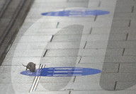 Mouse on empty tube platform during London lockdown
