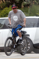 Adam Sandler enjoys a leisurely bike ride around his Malibu neighborhood as he takes a break during lockdown