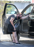 Arnold Schwarzenegger Stretching After a Bicycle Ride With son Joseph Baena