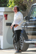 Mohamed Hadid, 71, cuts a dapper figure as he runs errands at one of his building sites on the day it was announced his daughter Gigi, 25, is expecting a baby with One Direction singer Zayn Malik.