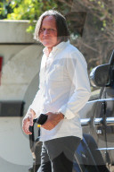 Mohamed Hadid, 71, cuts a dapper figure as he runs errands at one of his building sites on the day it was announced his daughter Gigi, 25, is expecting a baby with One Direction singer Zayn Malik.