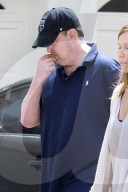 Matthew Perry looks tired as he steps out for an afternoon smoke break with a female friend. 