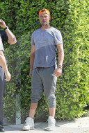 Josh Duhamel looks stressed and upset as he speaks to police outside his home in Los Angeles on Saturday afternoon [May 9.]