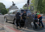 Armed Police stop to assist a motorist after his Range Rover broke down, they pushed it out of the Road at Hyde Park Corner.