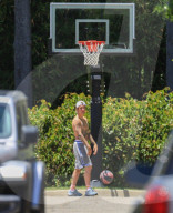 Justin Bieber playing basketball with friends