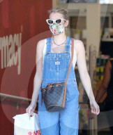 PREMIUM EXCLUSIVE Emma Roberts Looks Super Cute In Overalls During CVS Run