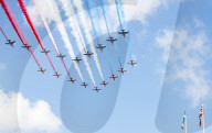 Boris Johnson and President Macron watch a flypast by The Red Arrows and their French counterparts La Patrouille