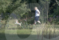Boris Johnson running this morning with dog Dilyn.