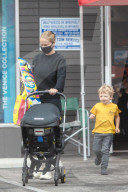 Australian model Lara Bingle steps out the day after her 33rd birthday to go surfboard shopping with her two of her three young children. 