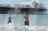 People flock to Brighton beach as the heatwave across the UK continues