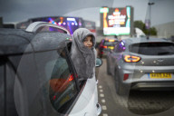 Drive-in bingo for NHS staff and key workers. The photographer Christopher Thomond spends an evening with visitors to the first Bingo Bedlam, a physically distanced drive-in bingo and singalong music session for NHS employees and other key workers, held d