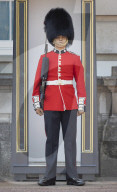 London heatwave. A guard overheats at Buckingham Palace.
