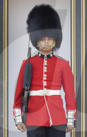 London heatwave. A guard overheats at Buckingham Palace.