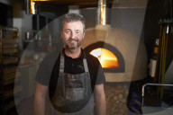 Baker Andrew Twentyman at his pizza restaurant and bakery in Leigh, Greater Manchester.