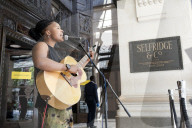 'There's money to be made': buskers return to Britain's high streets 
