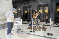 'There's money to be made': buskers return to Britain's high streets 