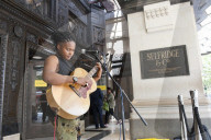 'There's money to be made': buskers return to Britain's high streets 