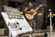 'There's money to be made': buskers return to Britain's high streets 