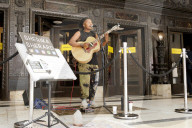 'There's money to be made': buskers return to Britain's high streets 