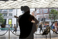 'There's money to be made': buskers return to Britain's high streets 