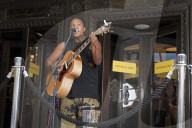 'There's money to be made': buskers return to Britain's high streets 