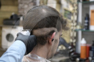 Locks off! London barbers reopen after lockdown - photo essay. Photographer Christian Sinibaldi went to five salons and met some of their first clients in need of a trim.