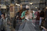 Locks off! London barbers reopen after lockdown - photo essay. Photographer Christian Sinibaldi went to five salons and met some of their first clients in need of a trim.