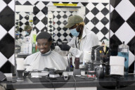 Locks off! London barbers reopen after lockdown - photo essay. Photographer Christian Sinibaldi went to five salons and met some of their first clients in need of a trim.