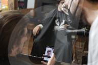 Locks off! London barbers reopen after lockdown - photo essay. Photographer Christian Sinibaldi went to five salons and met some of their first clients in need of a trim.