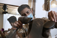 Locks off! London barbers reopen after lockdown - photo essay. Photographer Christian Sinibaldi went to five salons and met some of their first clients in need of a trim.