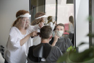 Locks off! London barbers reopen after lockdown - photo essay. Photographer Christian Sinibaldi went to five salons and met some of their first clients in need of a trim.