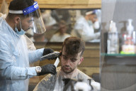 Locks off! London barbers reopen after lockdown - photo essay. Photographer Christian Sinibaldi went to five salons and met some of their first clients in need of a trim.