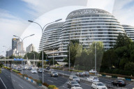 Beijing lowers public health epidemic emergency 