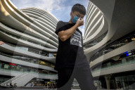 Beijing lowers public health epidemic emergency 