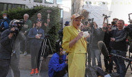 Vivienne Westwood suspended in a giant birdcage 