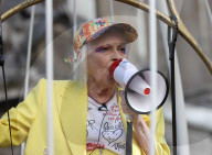 Vivienne Westwood suspended in a giant birdcage 
