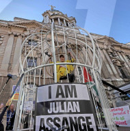 Vivienne Westwood suspended in a giant birdcage 