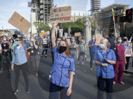 NHS workers march to Downing Street to demand a pay rise.