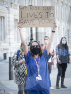 NHS workers march to Downing Street to demand a pay rise.