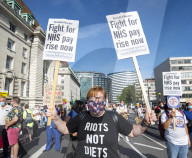 NHS workers march to Downing Street to demand a pay rise.